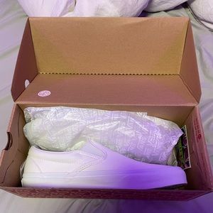 Women’s size 9.5 or men’s size 8 white slip on Vans